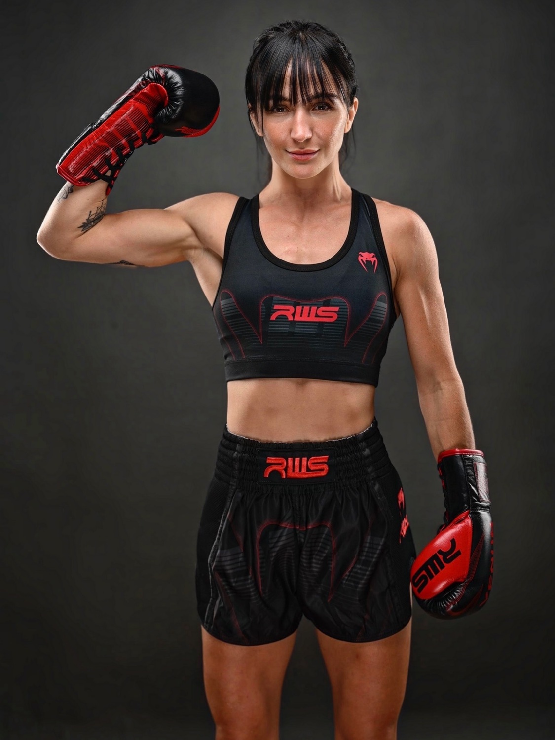 Jada Ketley studio portrait with RWS Venum kit and red boxing gloves